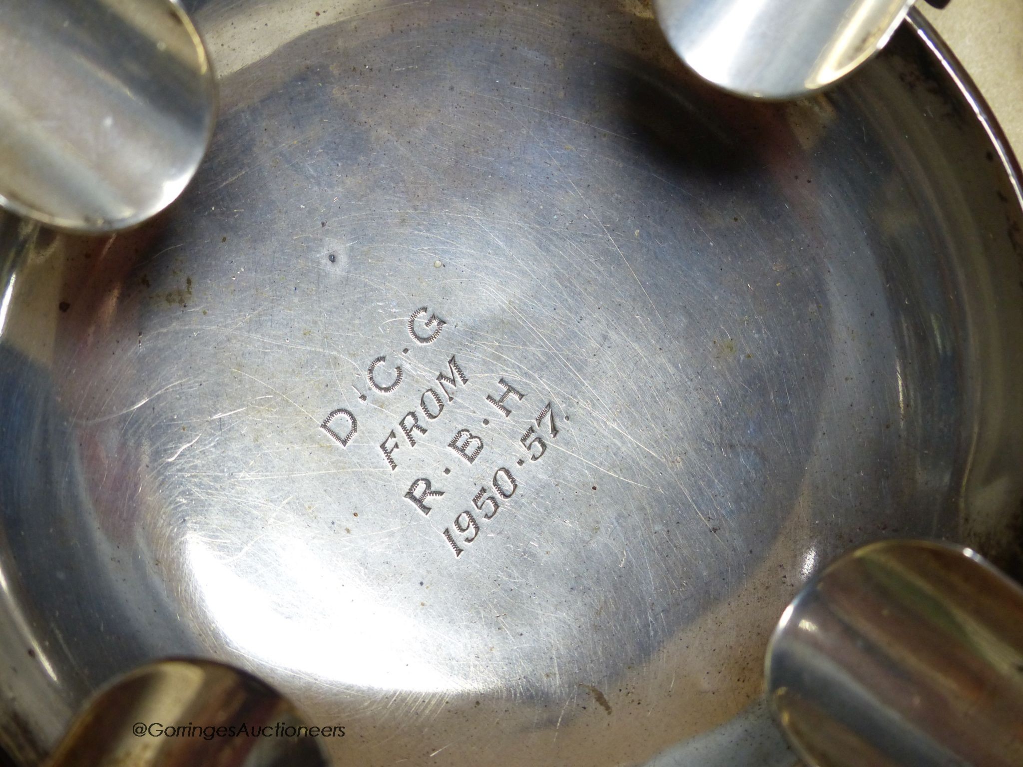 Small silver - a topped hair tidy, an ashtray, London 1900, 3.3oz., a napkin ring, a white metal scent bottle, 5.5cm, and a loaded posy holder, 7cm